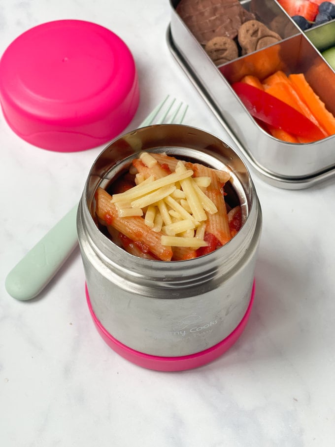 Sausage & Tomato Skewers in a lunchbox with cruties and chopped fruit
