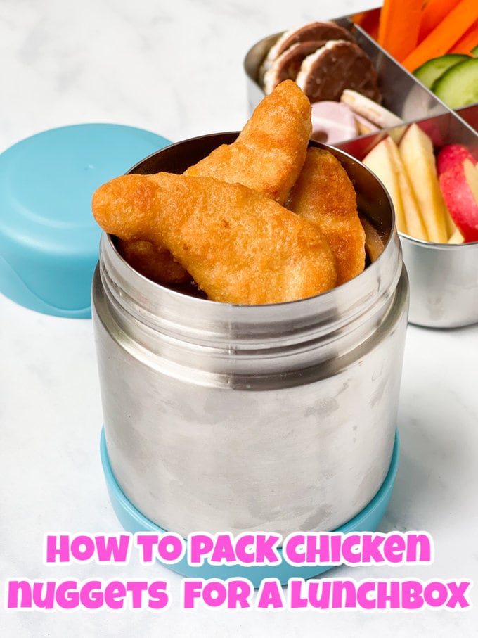 Chicken Nuggets in a small thermos with a packed school lunchbox in the background.