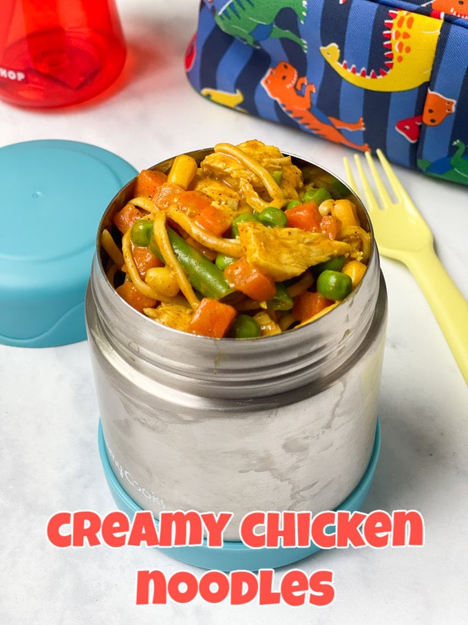 Creamy chicken noodles served in a metal food flask, food flask has a light blue lid.