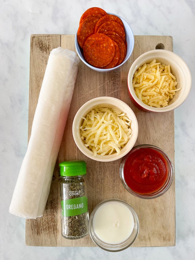 Ingredients arranged on a wooden chopping board.