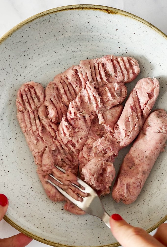 Mashed up sausage meat in a bowl.