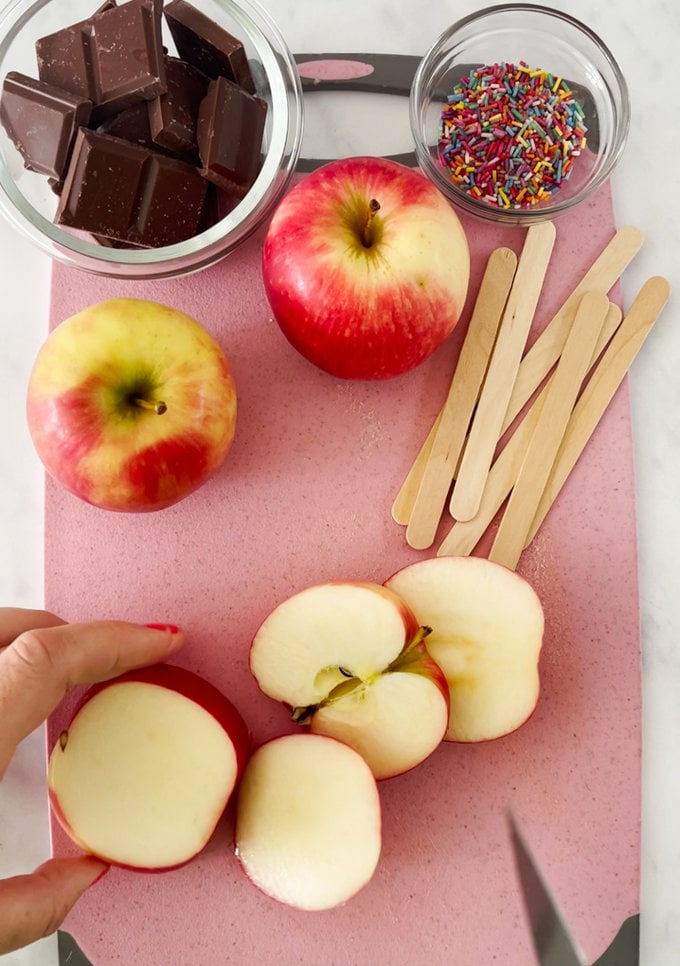 Apples being chopped into slices.