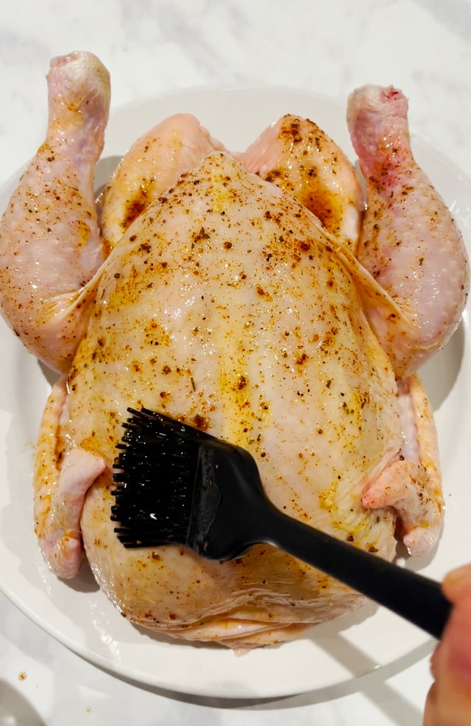 Chicken being prepared to go into the airfryer.