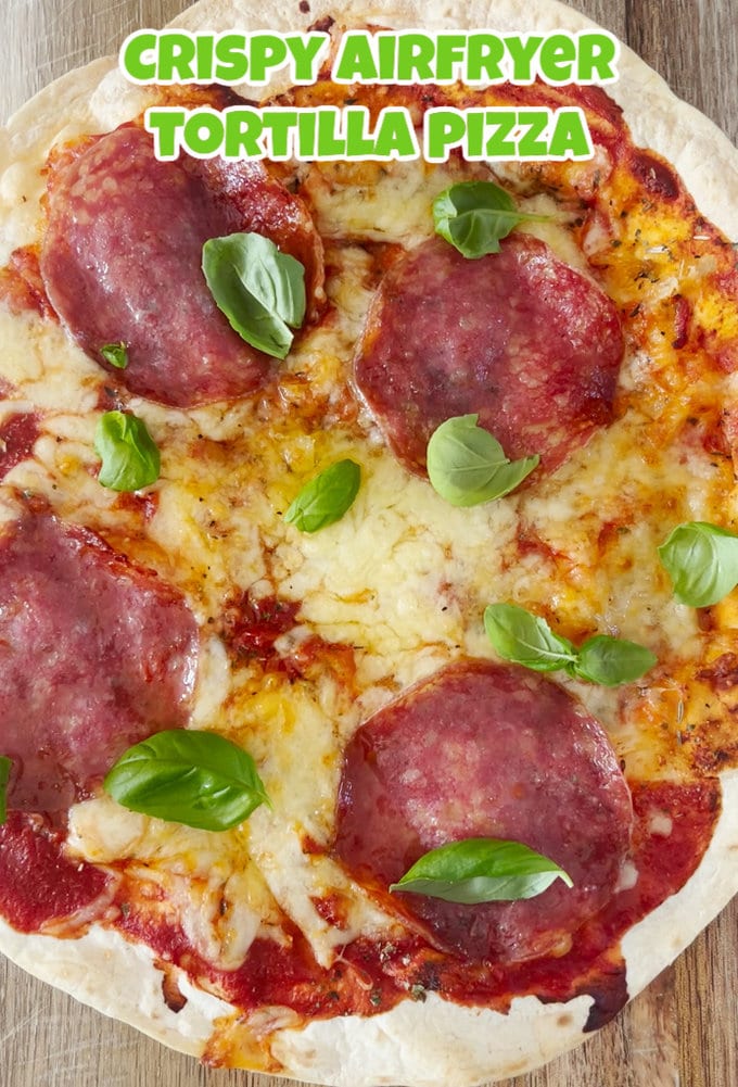 Airfryer tortilla pizza topped with basil leaves