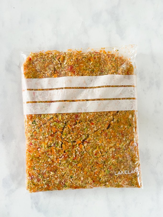 Vegetables all blitzed up and presented in a see-through freezer bag. 