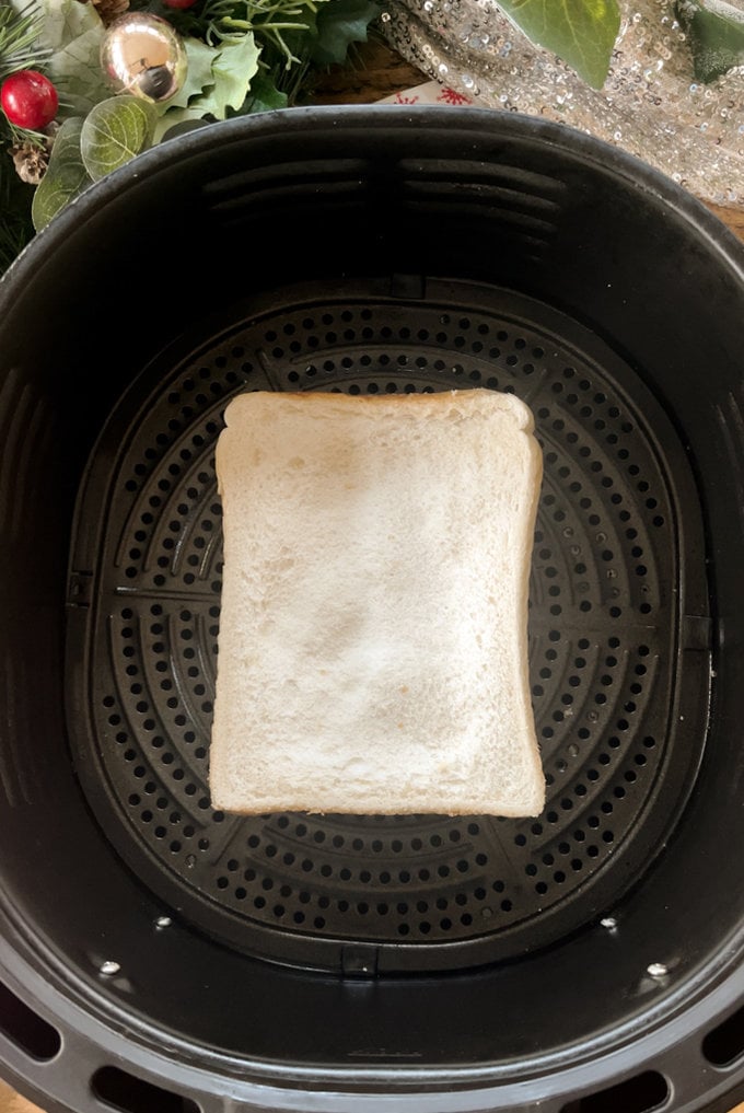 Toastie placed in the air fryer ready for cooking.