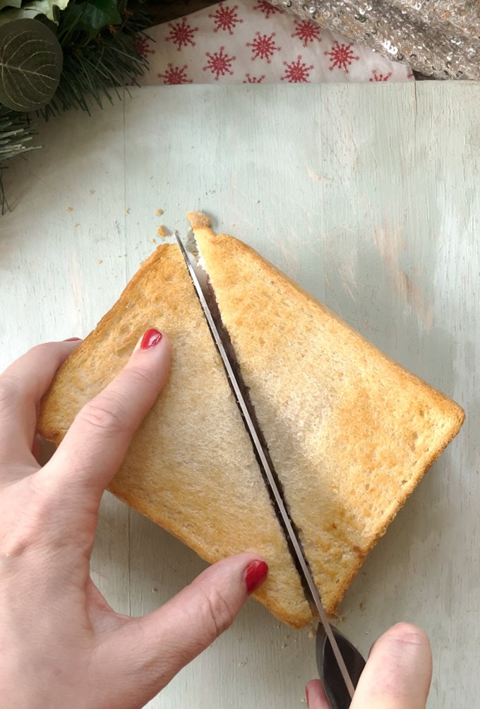 Toastie being cut in half.