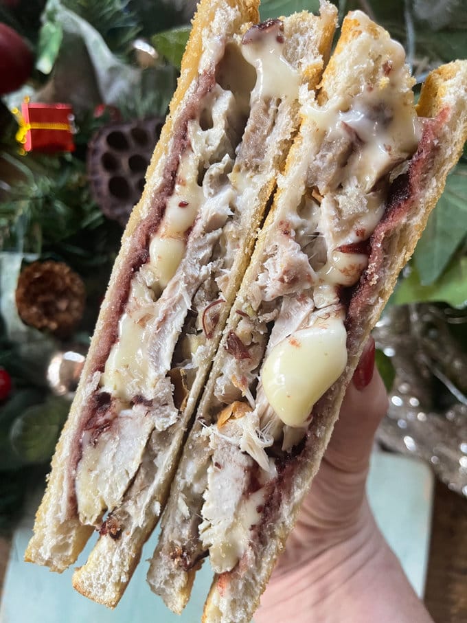 Christmas Leftovers Toastie cut in half to show all the fillings