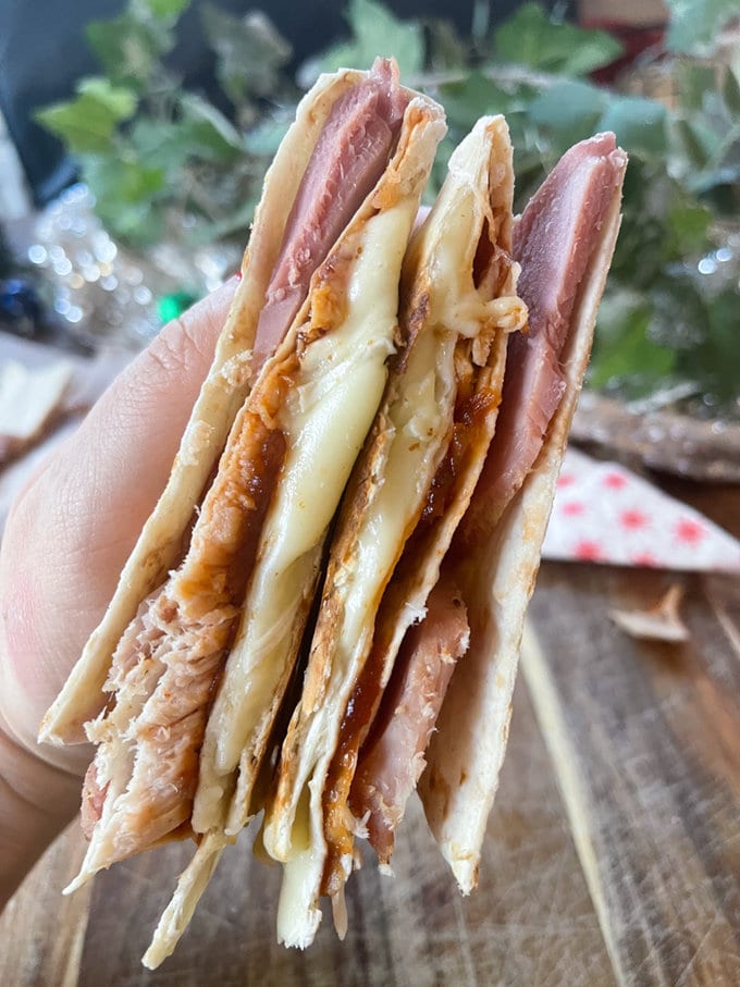 Toasted Christmas Leftovers Wrap cut in half to show all the fillings.