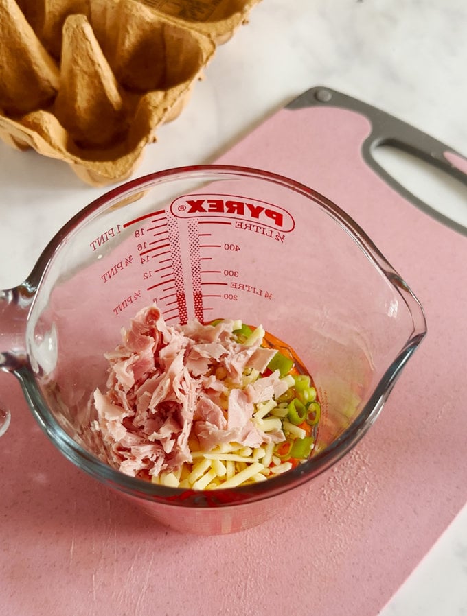 Ingredients being added to a clear pyrex jug.