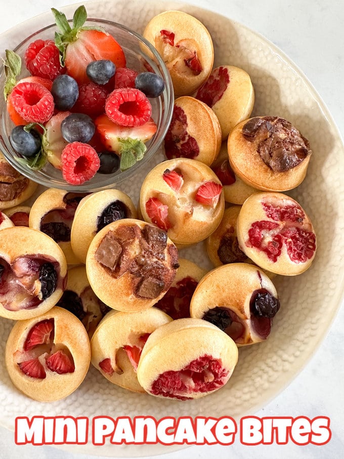 Mini Pancake Bites served in a bowl with a side serving of fresh berries