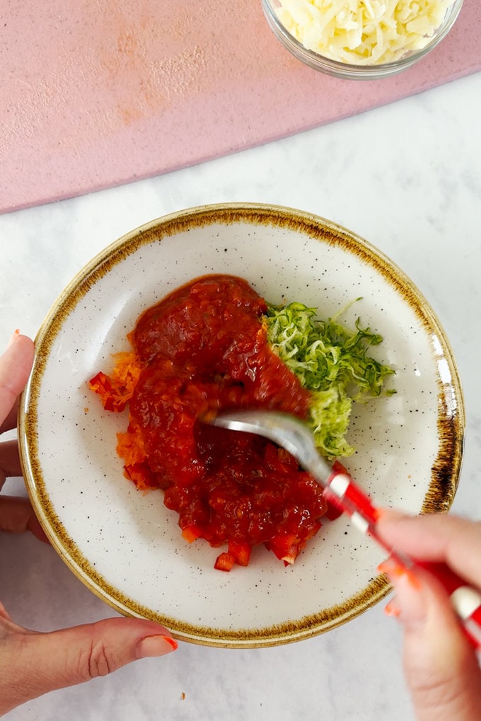 Ingredients being mixed together in a bowl. 