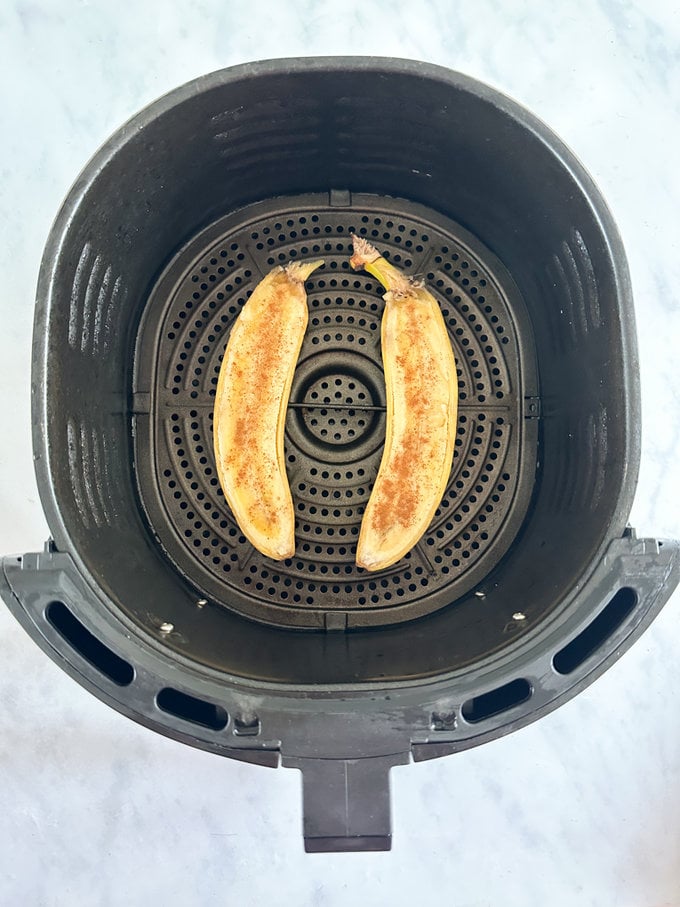 Prepped banana added to the airfryer, ready to be cooked.