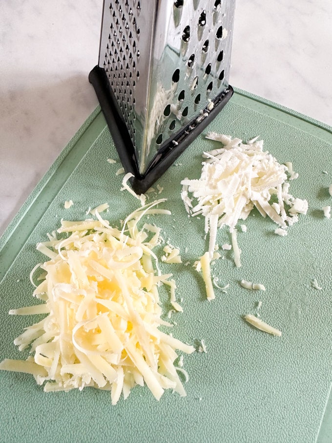 Grated cheddar and feta cheese.