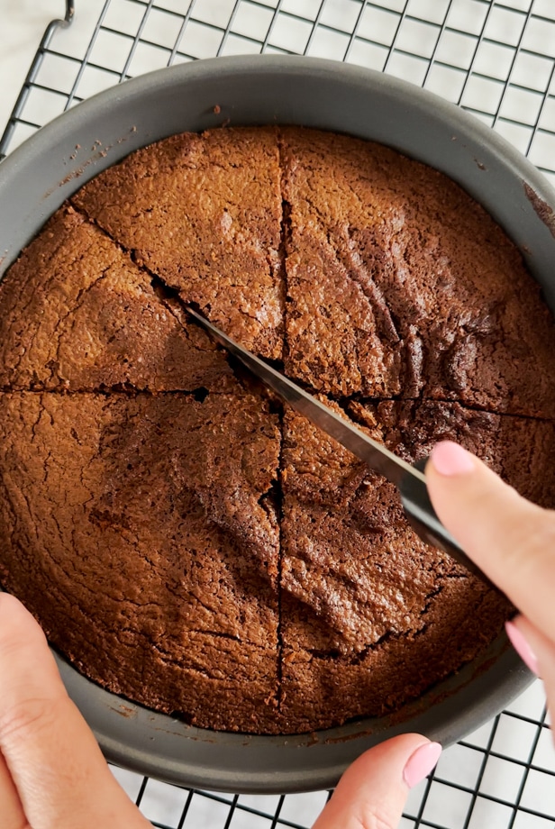 Cake bring sliced into sections.