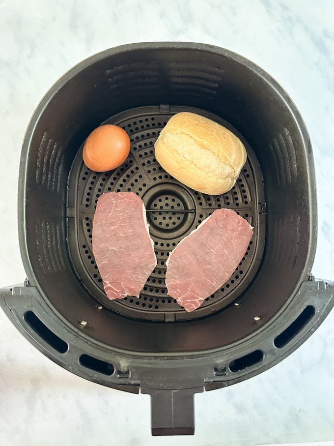 Raw ingredients placed in the airfryer drawer. Ready for cooking.