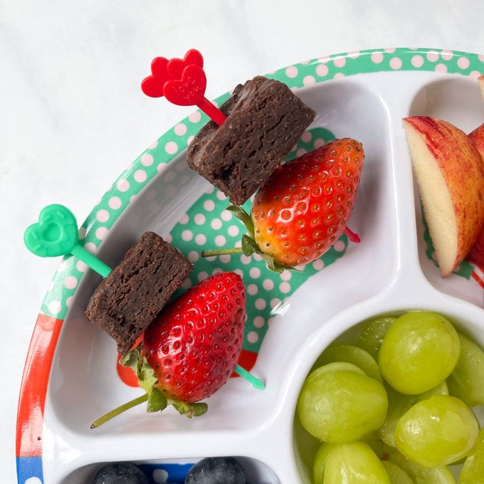 mini brownie bites and strawberries on the Brights Pick Sticks.