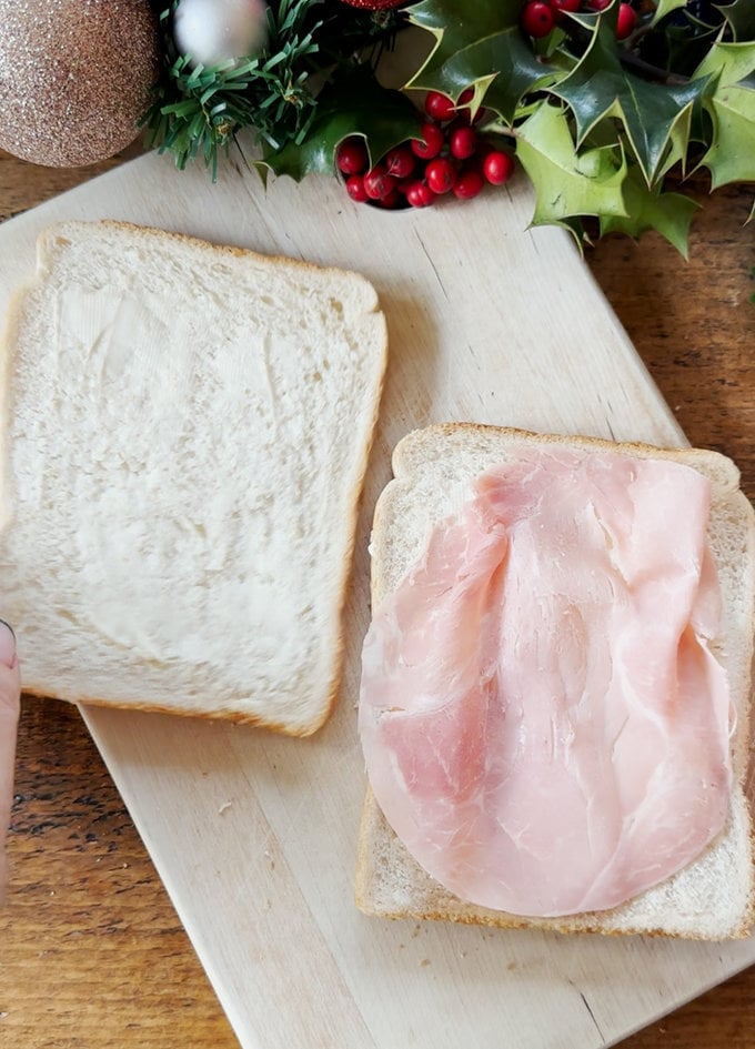 Christmas Sandwich Wreath being prepared and the fillings being put into the slices of white bread.