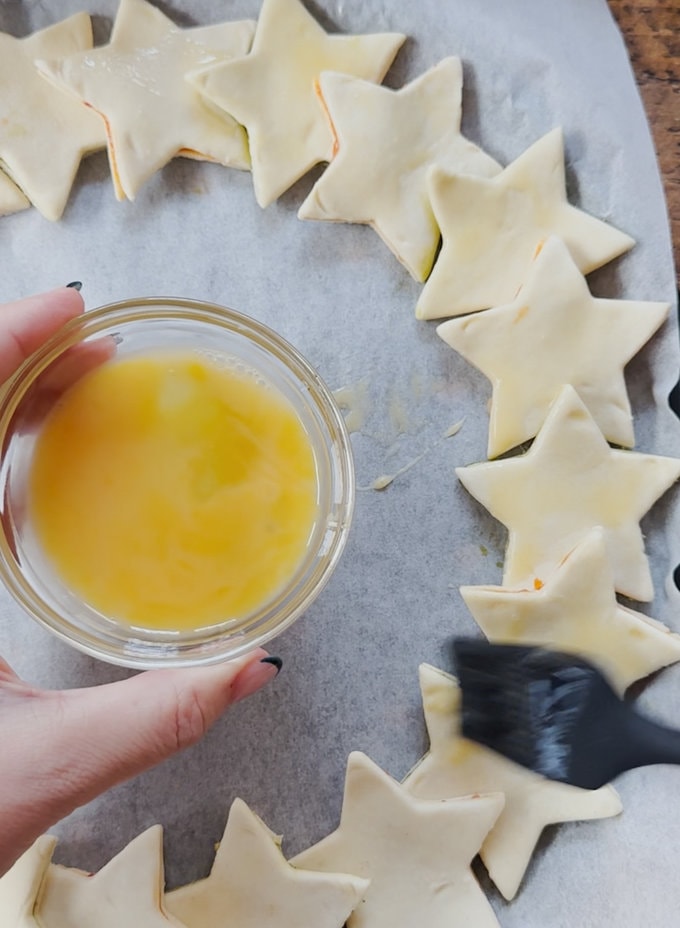 Star wreath being egg washed ready for the oven.