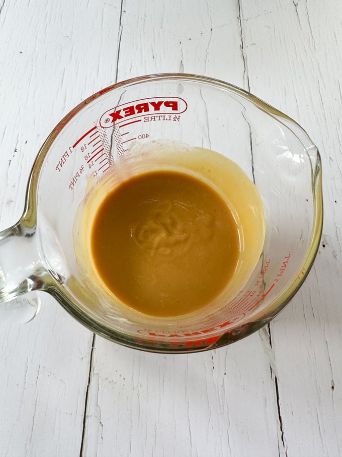 Peanut butter,butter & Oil added to a glass pyrex jug.