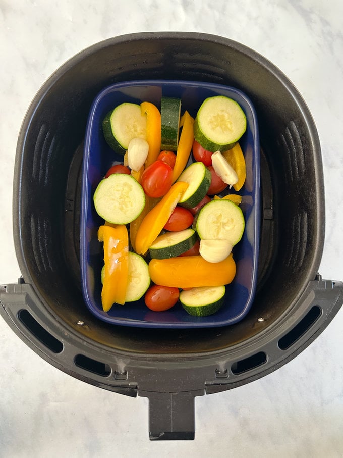 Oven dish placed in Airfryer drawer ready to be cooked.