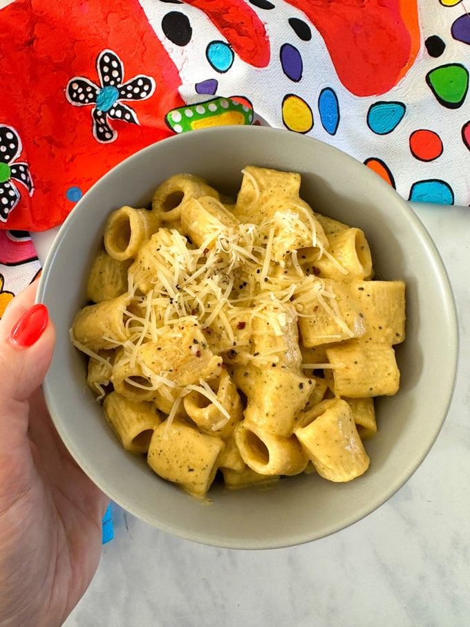 Pasta now ready and served in a bowl and garnished with grated cheese.