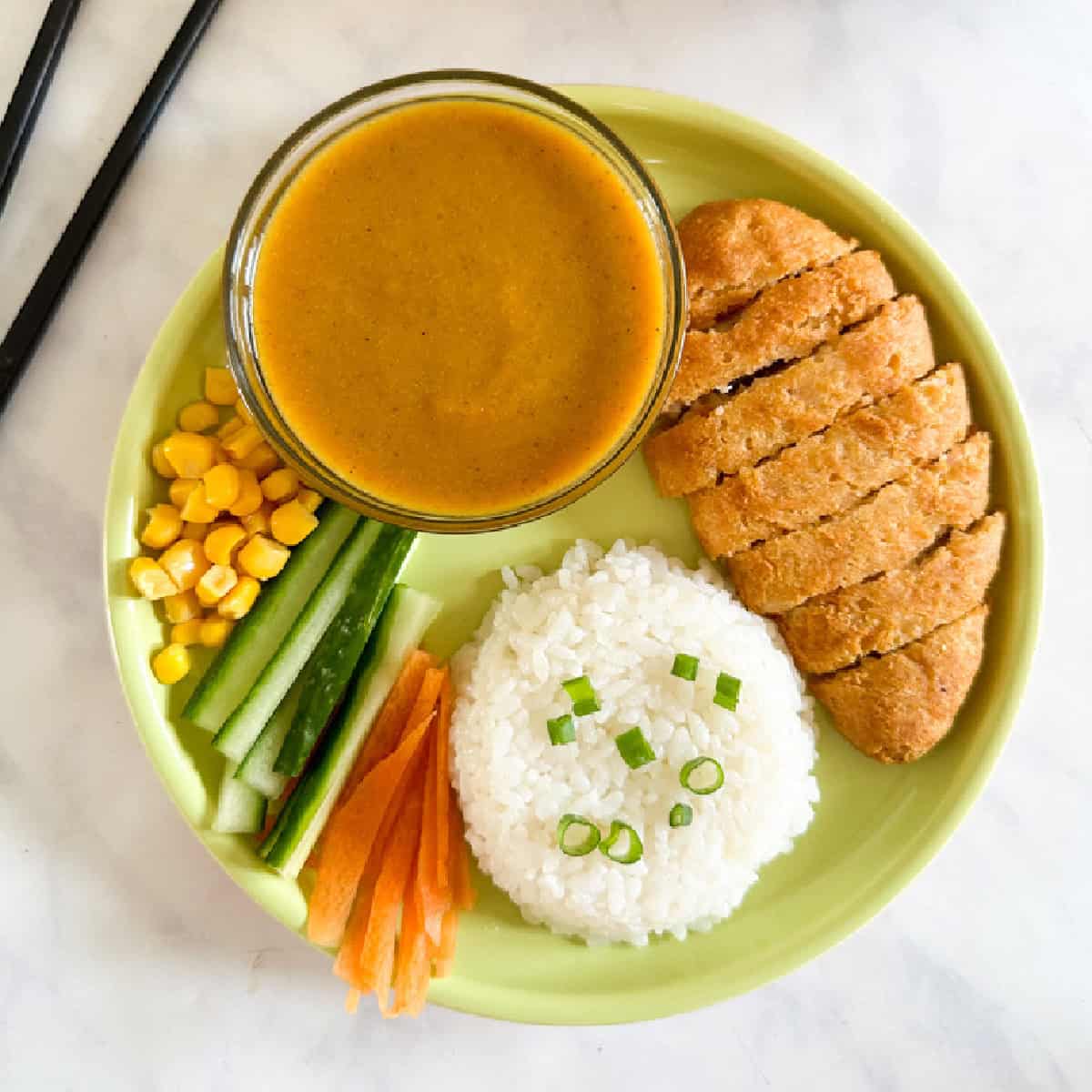Hidden Veg Katsu sauce recipe on a plate with breaded chicken rice and vegetables
