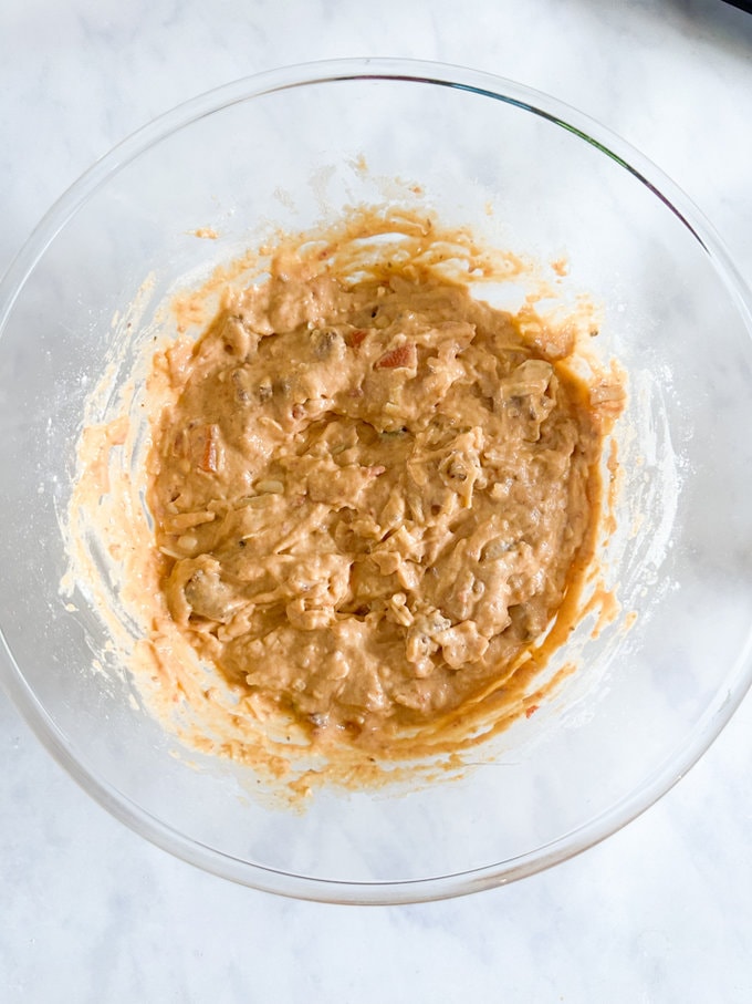 Muffin mix in a glass mixing bowl.