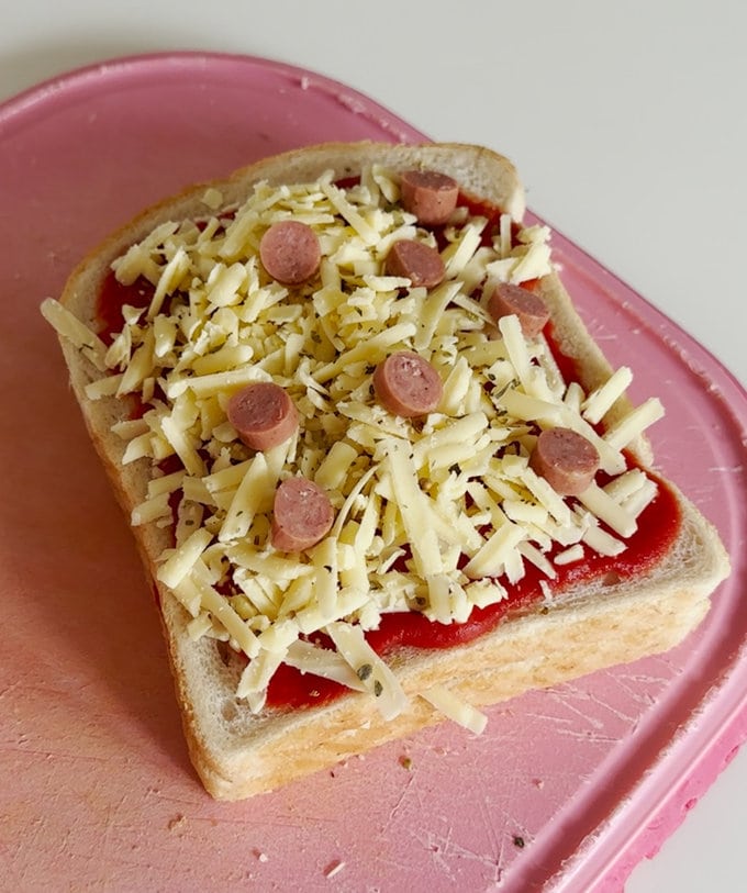 Mini pepperami slices are added to the slice of bread.