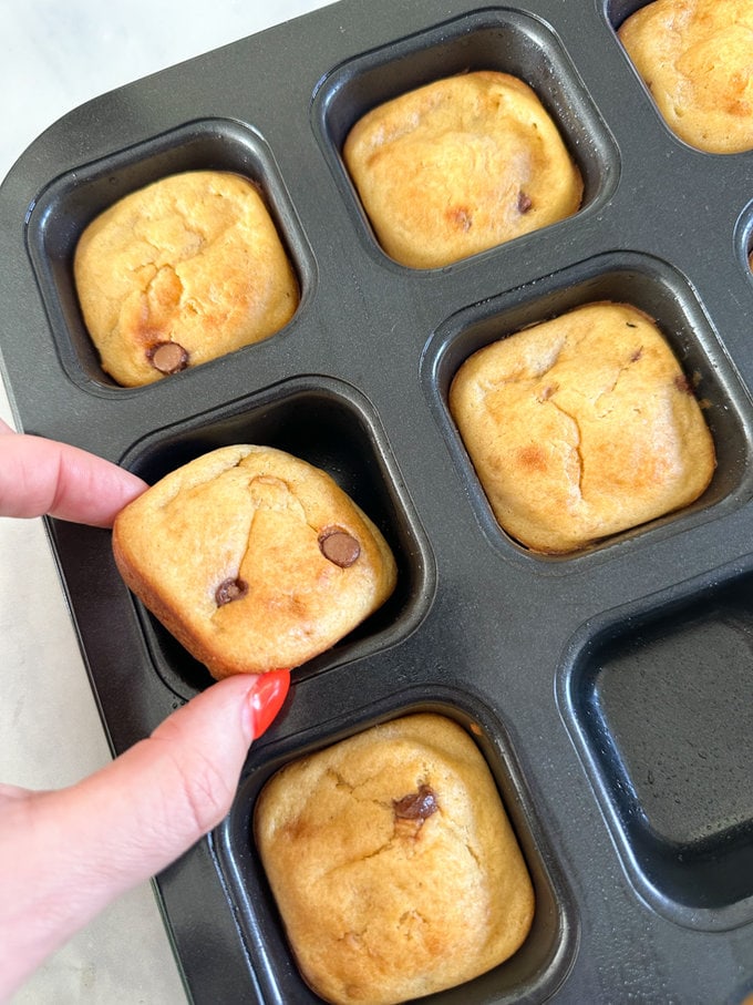 Mini Chocolate Chip Banana Bread just out of the oven in a square muffin tray.