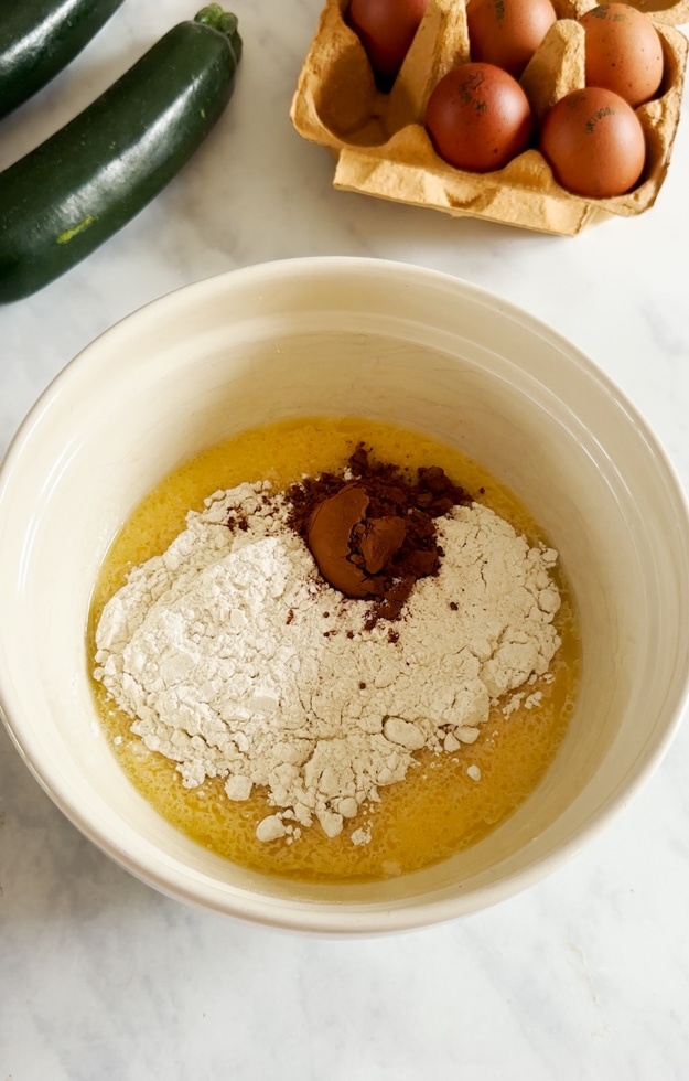 Ingredients being added to a mixing bowl.