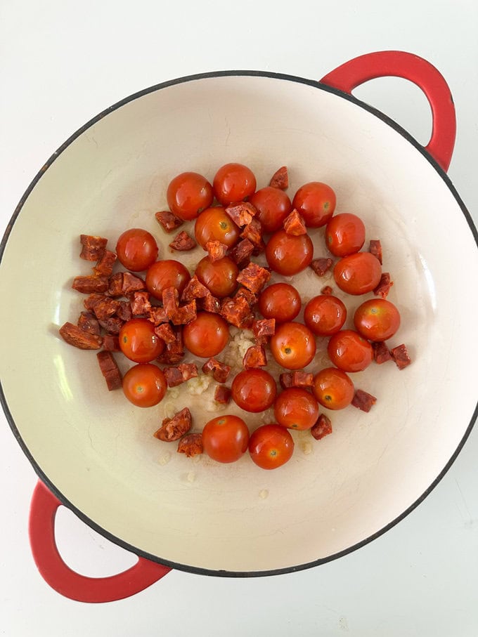 Ingredients being added to a dish ready for cooking.