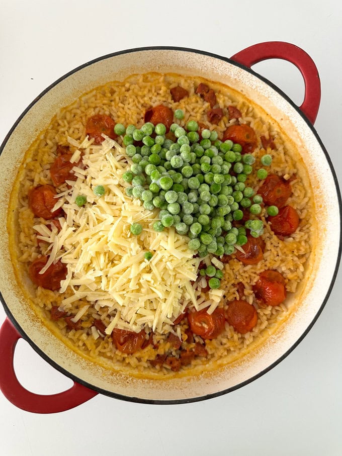 More ingredients added to a ovenproof dish.