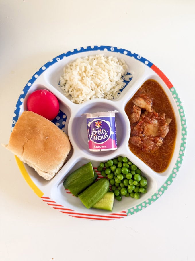 Slow Cooker Butter Chicken served in a Midi divided child's plate making it easier for a child to eat.