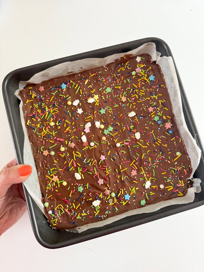 Chocolate Weetabix Bars cut into small squares and decorated with brightly coloured sugar strands.