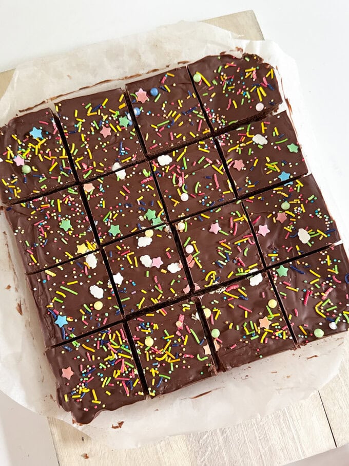 Chocolate Weetabix Bars cut into small squares and decorated with brightly coloured sugar strands.
