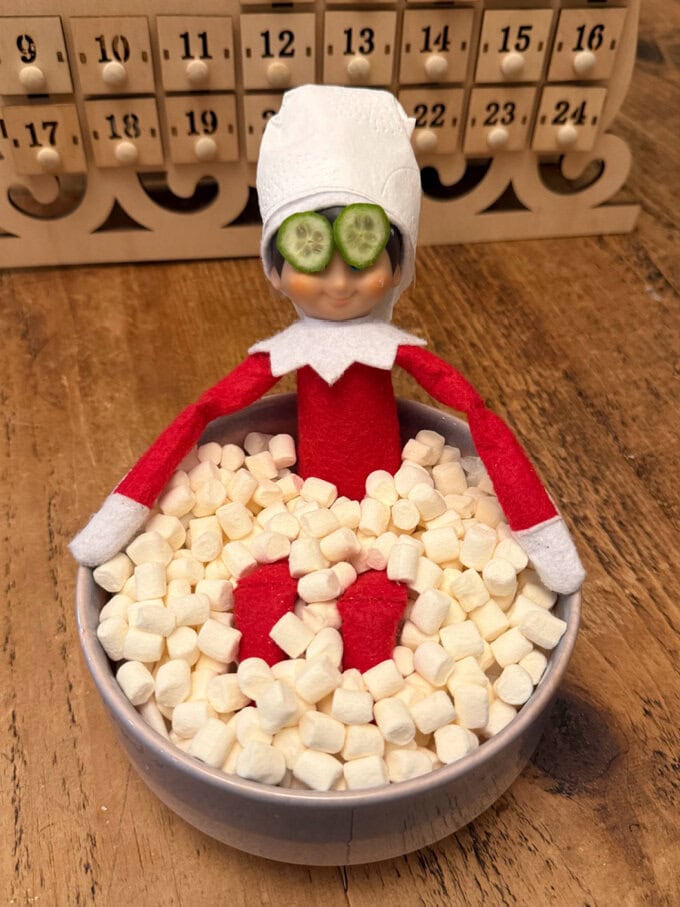 The poor guy needs a break after all his antics this month!I popped him into a bowl. I put in srunched up balls of toilet paper to fill out the bottom of the bowl and then topped with white mini marshmallows.Wrap toilet paper round his head so that it looks like a towel then cut some thin slices of mini cucumbers for the eyes.