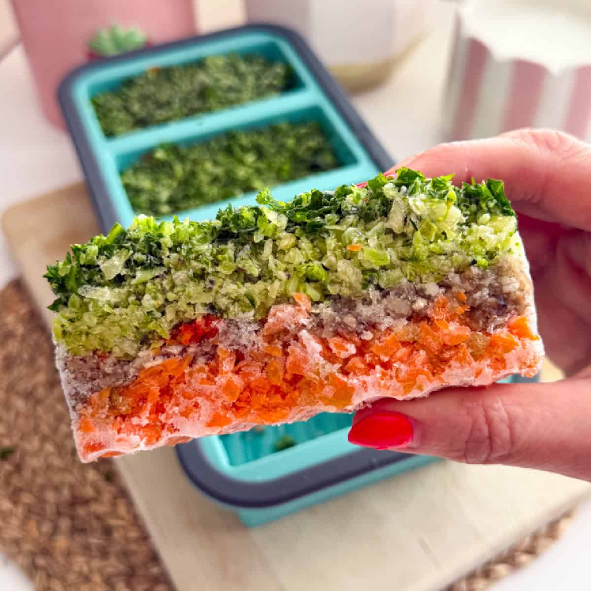 A close up photo of a frozen veggie cube.