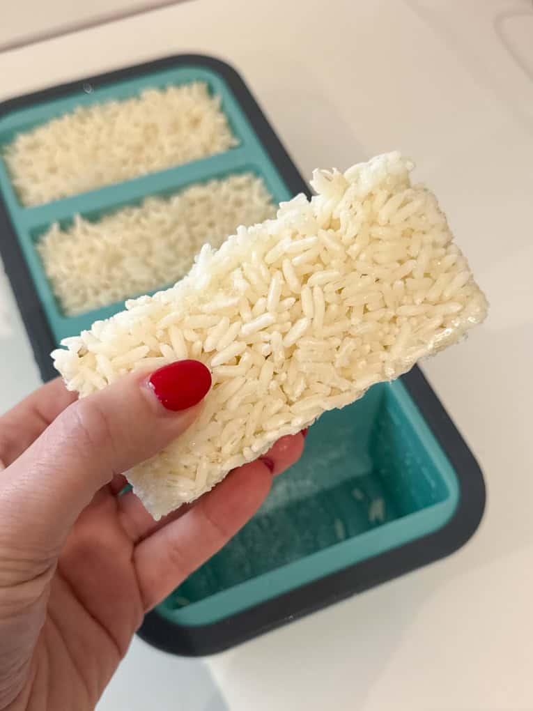 A frozen block of rice taken out of the mould.