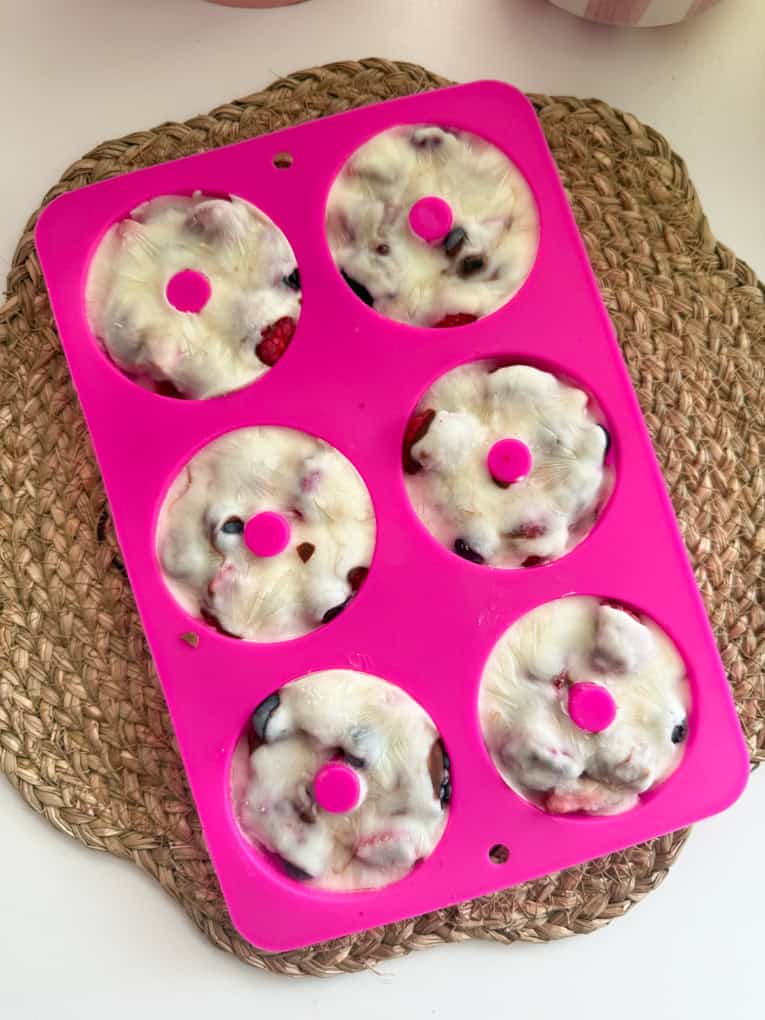 Frozen berry donut in the bright pink donut silicone mould.