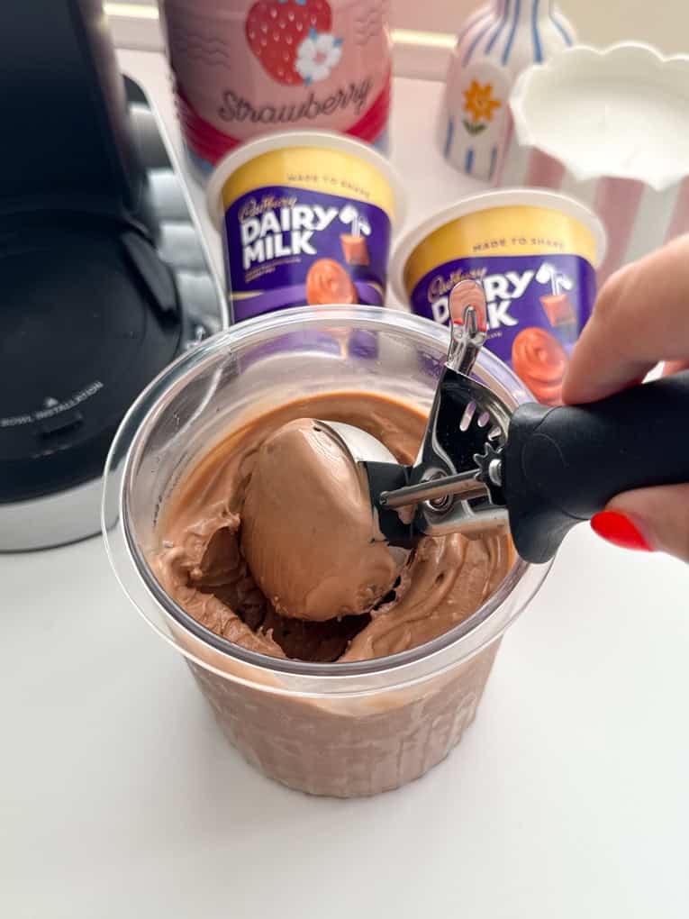 A big scoop of Ninja Creami Pot Of Joy on a metal ice cream scoop.